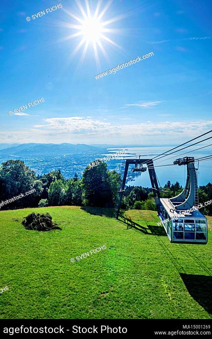 A gondola of the Pfänderbahn. In the background below Lake Constance