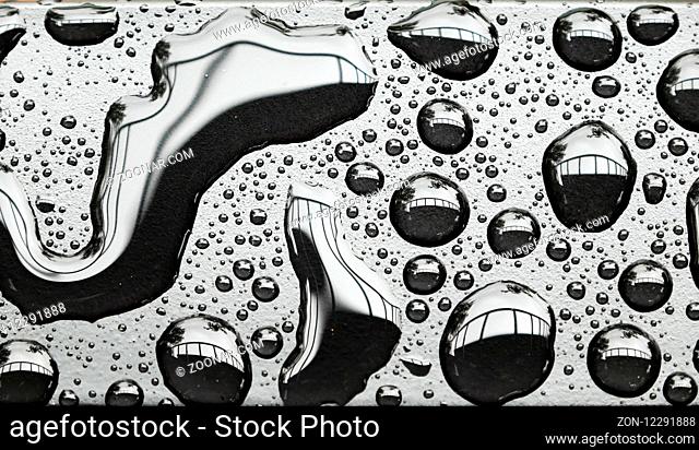 Amazing shape of rain drop on steel surface after rainy day, water drops make abstract nature texture