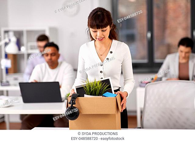 female employee with personal stuff at office