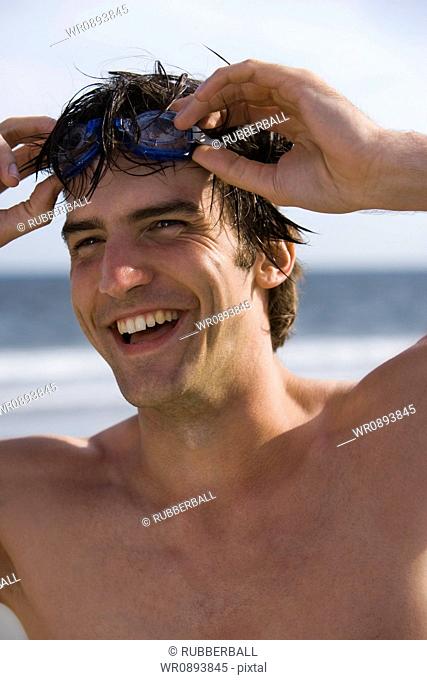 Portrait of a young man on the beach
