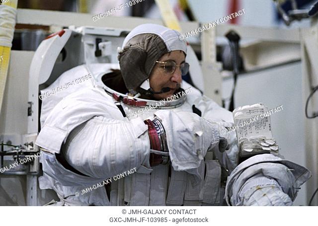 Astronaut Linda M. Godwin, STS-108 mission specialist, attired in the training version of her Extravehicular Mobility Unit (EMU) space suit