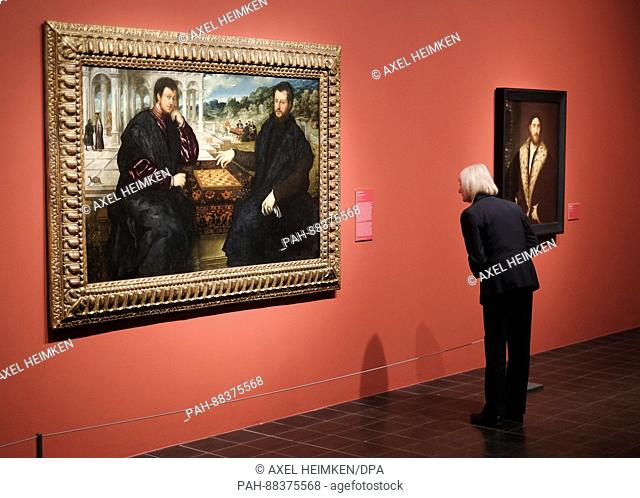 A woman looks at works of art on display as part of an exhibition entitled 'The Poetry of Venetian Painting' in Hamburg, Germany, 23 February 2017