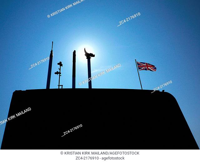 British submarine conning tower with a raised periscope and union jack