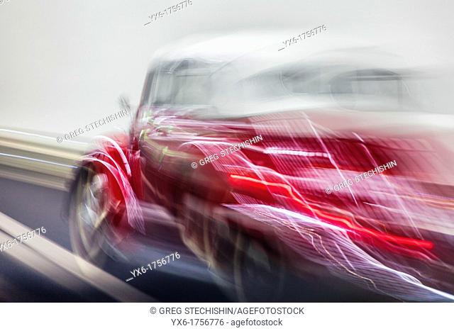 A vintage VW Beetle convertible speeding by