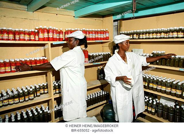 Two women at a grocery warehouse in New Amsterdam, Guyana, South America