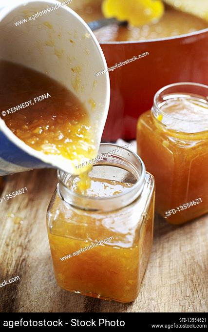 Pouring marmalade into jars, Southend-on-sea, Essex, England, UK