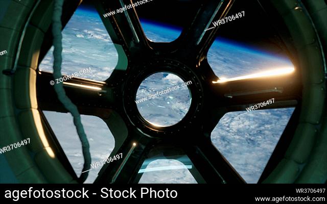 Cockpit view from International Space Station operating nearby of planet Earth. Elements of this image furnished by NASA