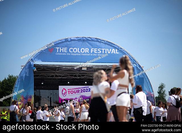 30 July 2022, North Rhine-Westphalia, Neuss: On stage is ""The Color Festival"". The ""Color Feelings"" festival, also called the ""Holi Festival of Colours