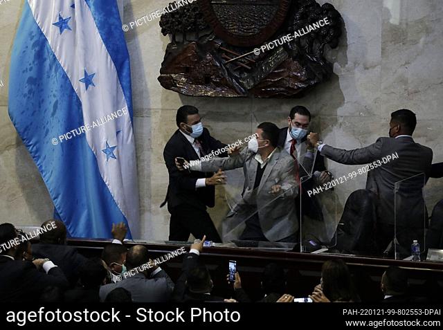 21 January 2022, Honduras, Tegucigalpa: Members of Parliament clash during the election of the new Speaker of the Chamber of Deputies