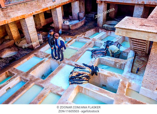 FEZ, MOROCCO - DECEMBER 10: Men working at tannery pools for leather production in Fez. December 2016