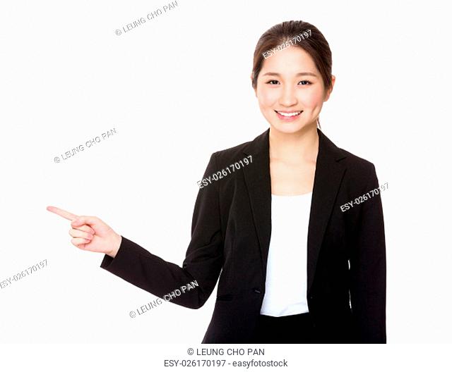 Businesswoman with finger point aside