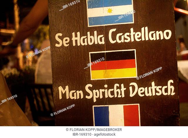 Signboard in a Restaurant in Buzios, Brazil saying Man Spricht Deutschand Se Habla Castellano with german flag