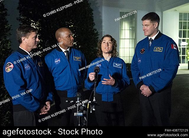 Artemis II crew members Reid Wiseman(L), Victor Glover(2nd L), Christina Hammock Koch(2nd R), and Jeremy Hansen(R) take turns speaking to the media outside the...