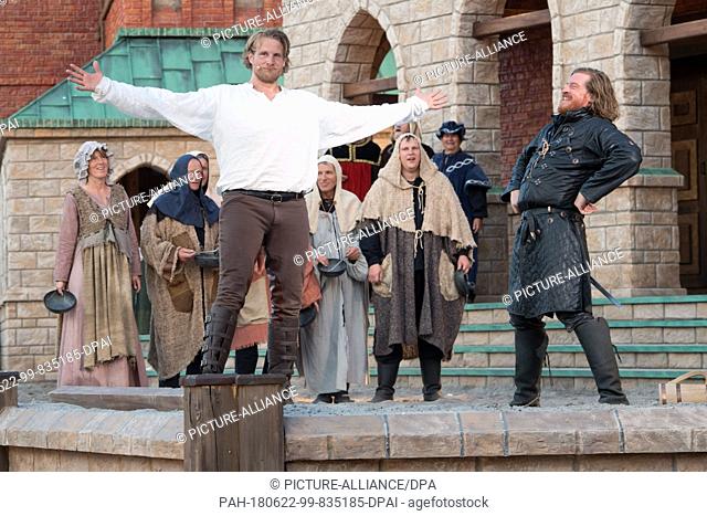 20 June 2018, Germany, Ralswiek: Alexander Koll as pirate Klaus Stoertebeker (L) and Alexander Hanfland as Goedeke Michels acting onstage during the press...