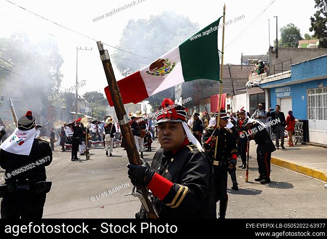 MEXICO CITY, MEXICO - MAY 5, 2022: Inhabitants of Peñón de los Baños neighborhood take part during a reenactment to commemorate the 160th anniversary of the...