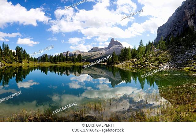 Lago Federa and the Croda da Lago G. Palmieri refuge, in the bacground Mount Becco di Mezzodì, Dolomites, Cortina d'Ampezzo, Veneto, Italy