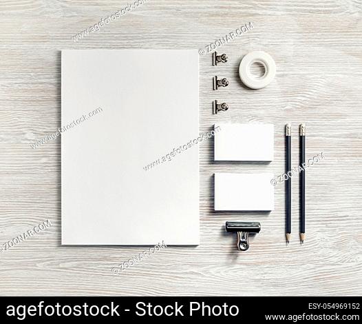 Blank stationery set on light wood table background. Template for branding identity. For graphic designers presentations and portfolios. Flat lay