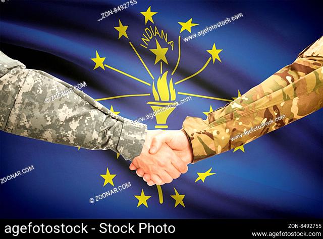 Soldiers handshake and US state flag - Indiana