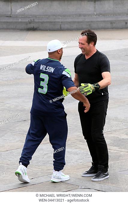 Russell Wilson and David Seaman seen filming a commercial for the NFL in Trafalgar Square Featuring: David Seaman, Russell Wilson Where: London