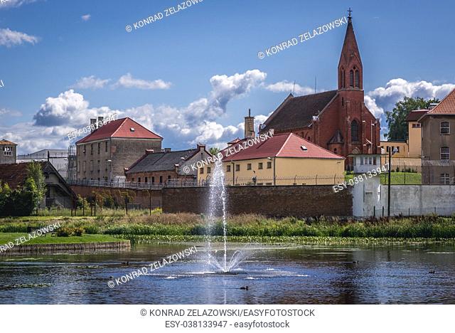 Prison in Barczewo town in former Franciscan monastery, Poland. View with Church of Saint Dismas also known as Good Thief