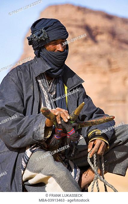 Africa, Libya, Jabal Akakus, Tuareg, rding a camel, portrait