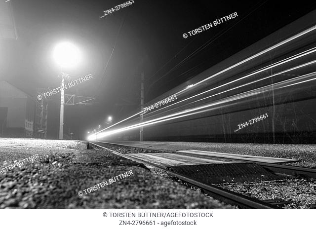 Train Passing by Langwies Station at Night in the Salzkammergut area, Ebensee, Austria