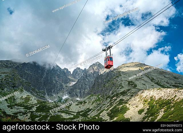 Red cabin of ropeway from Skalnate pleso to peak Lomnicky stit in Tatras mountains on July 26, 2014 in Tatranska Lomnica