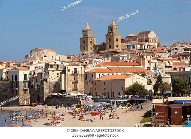 Scene from the the beach with the houses of the town and the Cathedral at the background, Cefalu, Sicily, Italy, Europe