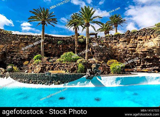 tropical garden with swimming pool, jameos del agua, art and cultural site, built by césar manrique, spanish artist from lanzarote, 1919-1992, lanzarote
