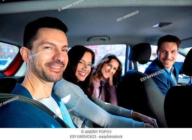 Group Of Happy Friends Having Fun In The Car