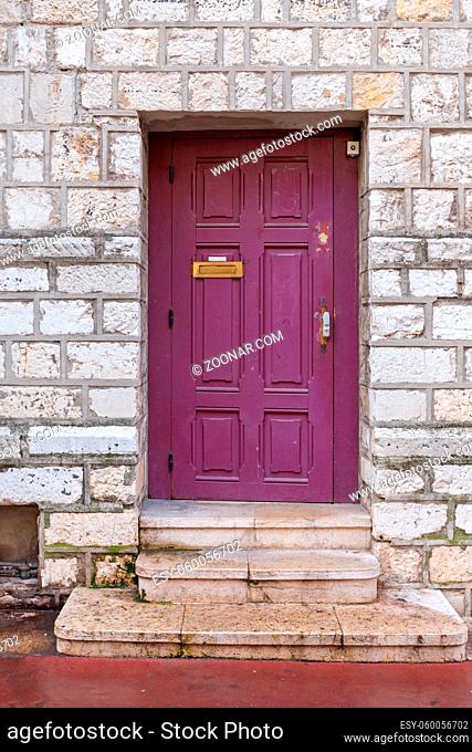 Purple Door at Stone Building in Cannes France