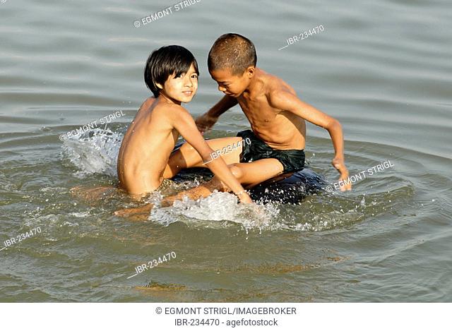 Children playing in the Irrawaddy river, Myanmar