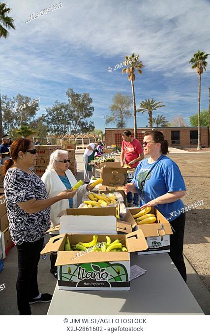 Marana, Arizona - Volunteers from St. Christpher Catholic Parish distribute produce provided by the Borderlands Food Bank
