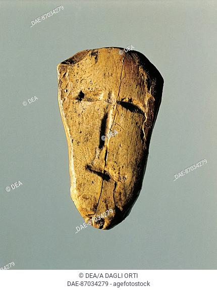 Prehistory, Czech Republic, Paleolithic, Gravettian - Bone pendant depicting human figure from Dolni Vestonice.  Brno, Etnograficke Muzeum Moravskeho Muzea V...