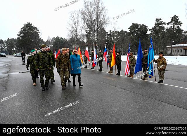 Czech Defence Minister Jana Cernochova, in blue, Chief of Staff Karel Rehka, front left, and some lawmakers visited the 60 members of the Czech military...