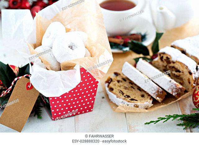 Food gifts donuts and christmas stollen with dried fruits