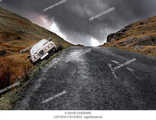 England, Cumbria, Conniston. Crashed Jaguar S Type on Wrynose Pass in Cumbria
