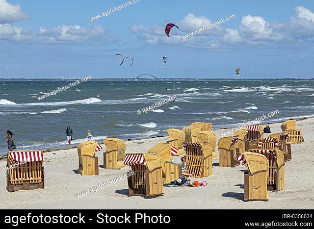 Beach chairs, kite surfers, Fehmarnsund Bridge, Steinwarder Peninsula, Heiligenhafen, Schleswig-Holstein, Germany, Europe