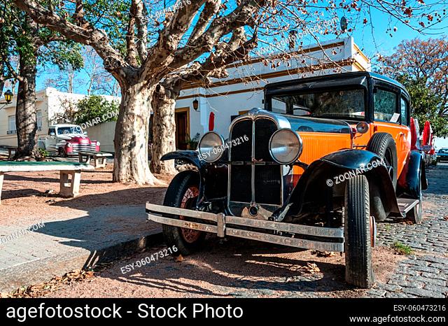COLONIA, JULY 29: Vintage cars participate in the street exhibition in Historic neighborhood in Colonia, Unesco World Heritage town - July 29