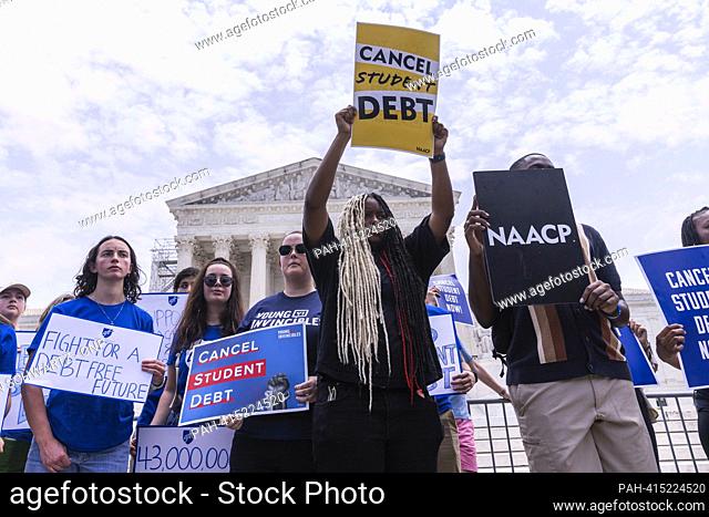 Protesters holding signs advocating for the cancellation of student debt stand in front of the United States Supreme Court in Washington, DC on Friday, June 30
