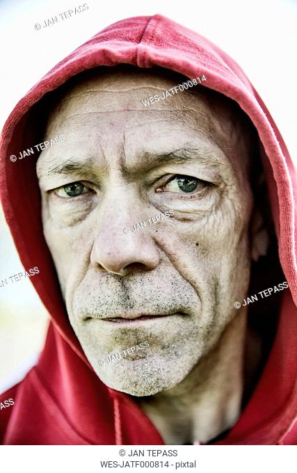 Portrait of man with red hood