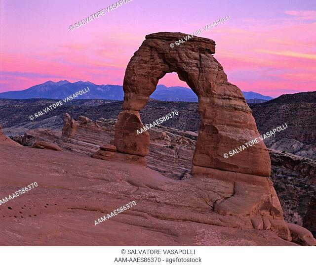 Sunset Clouds over Delicate Arch and the La Sal Mountains in the Colorado Plateau, Grand County, Arches National Park, Utah