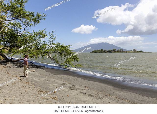 Nicaragua, Rivas province, Ometepe island, tourist in Charco Verde nature reserve watching Concepcion volcano