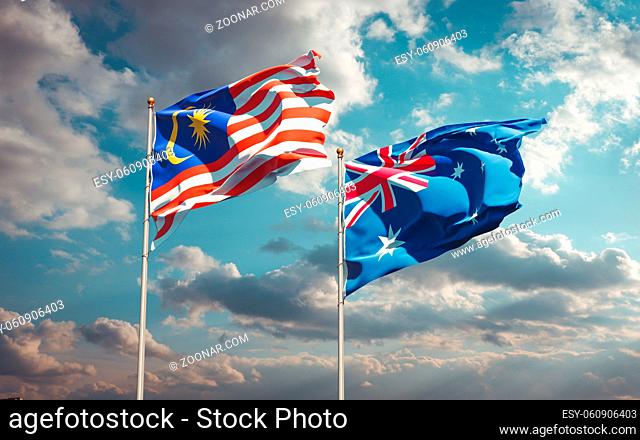 Beautiful national state flags of Malaysia and Australia together at the sky background. 3D artwork concept