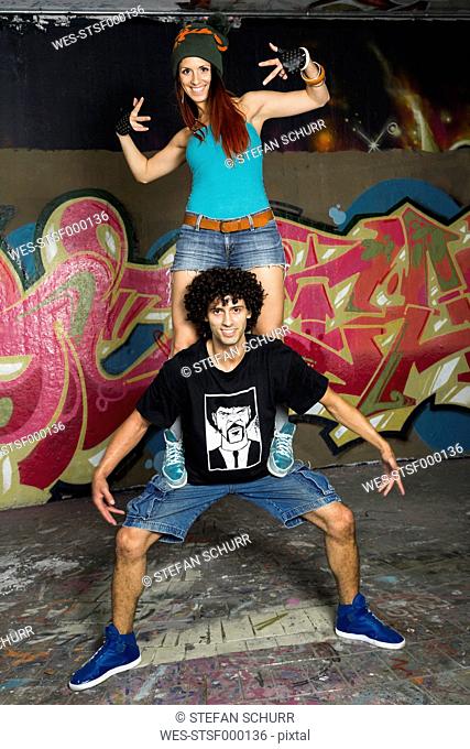 Germany, Stuttgart, Hall of Fame, Two Hip Hop dancers at airbrush wall