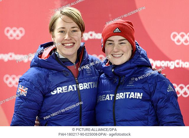 Lizzy Yarnold (L, gold) and Laura Deas (bronze) from the UK celebrating their medals on the podium during the award ceremony of the women's skeleton event in...