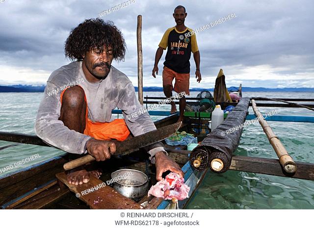 Fisherman on Outrigger Boat, Cenderawasih Bay, West Papua, Indonesia