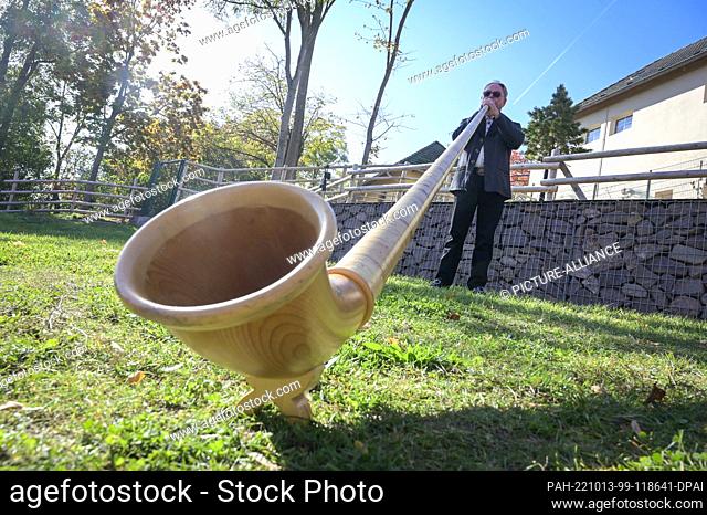 12 October 2022, Saxony-Anhalt, Halle (Saale): Alphorn sounds at the handover of the newly designed ""Reils-Alm"" facility in the Halle mountain zoo