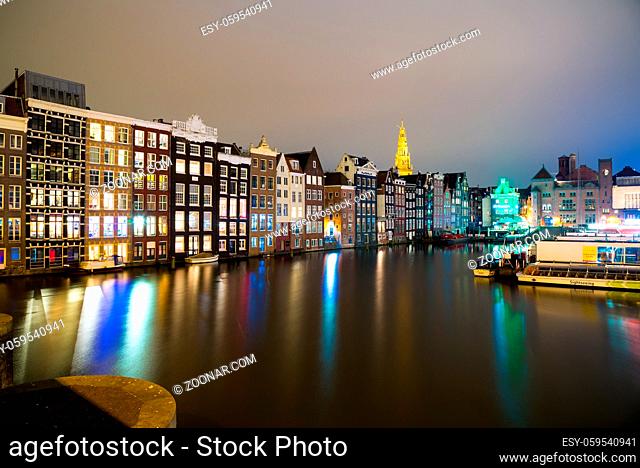 View of the Amsterdam canals and embankments along them at night