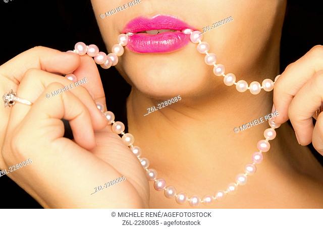 lushcious lips with pearl necklace